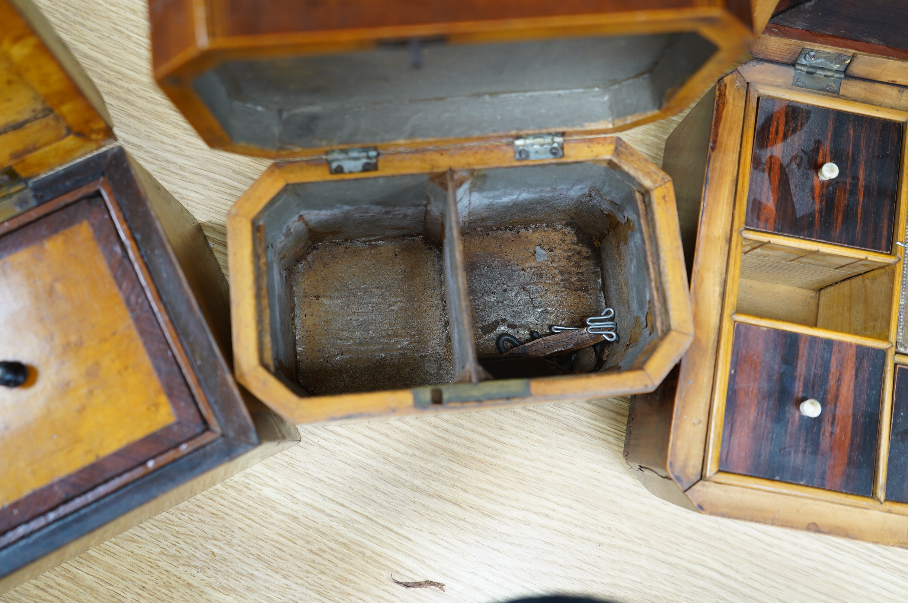 A 19th century mahogany work box and two tea caddies, largest work box 29cm wide, 20cm deep (3). Condition - poor to fair